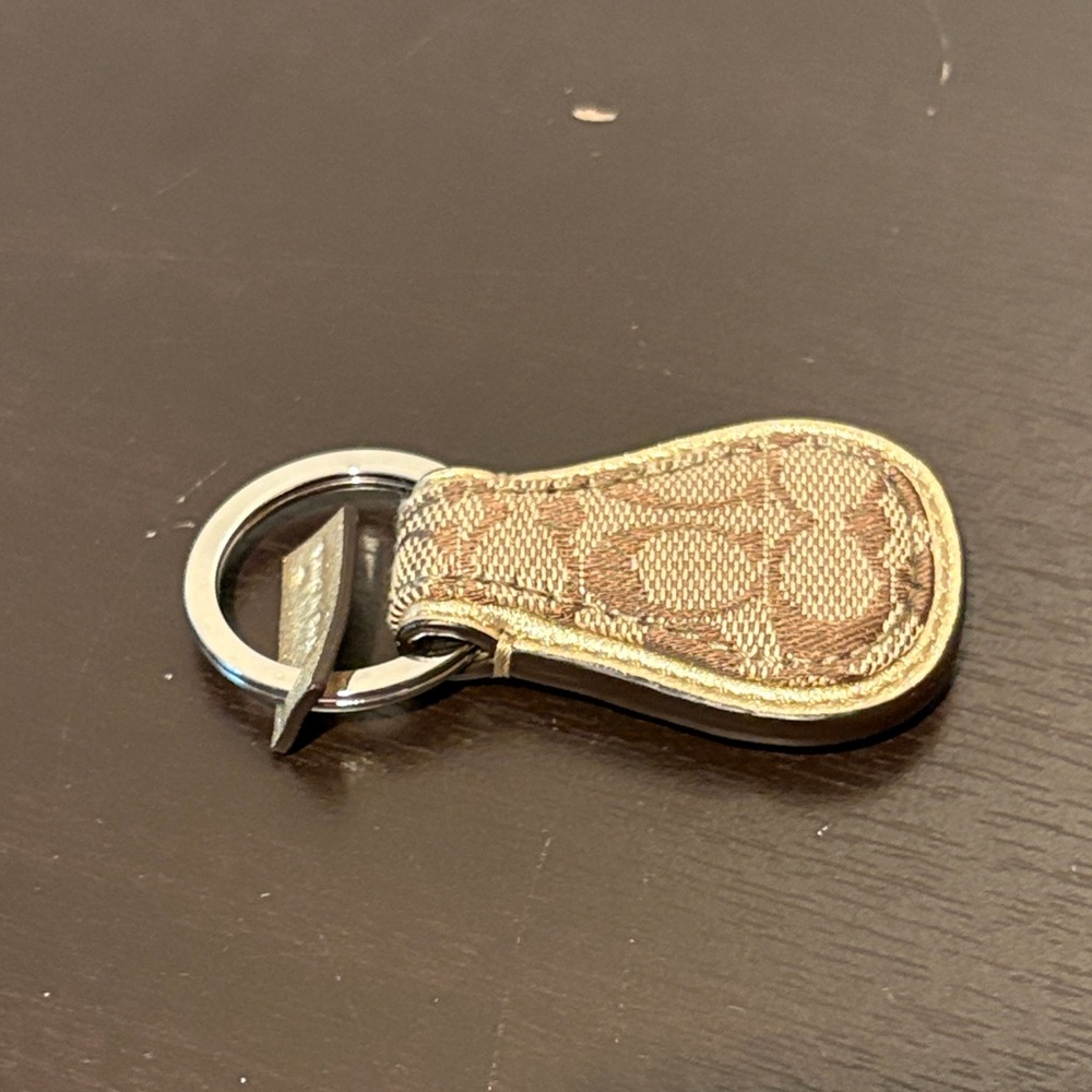 Preowned Coach Gold and Brown Keychain.